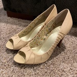 Nude Round Of Applause Peep Toe Pumps